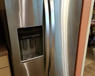 Stainless double door Whirlpool fridge with water and ice dispenser