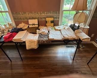 75-100 year old linens - table cloths, napkins, table runners and even old hankies.