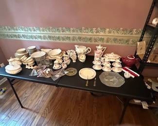 Antique dishes momagramed "M" dishes while with gold trim.