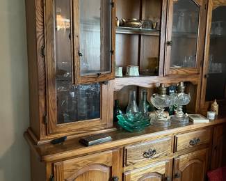 This hutch is unique in that all the upper cabinet doors have "wavy glass." A beautiful vintage oak piece for the right home.