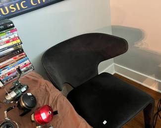 Fishing reels and black chair. There are 2 of them