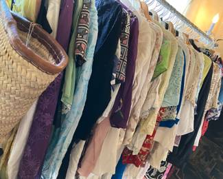 3 racks of women's clothes some from clothing line never worn , some vintage