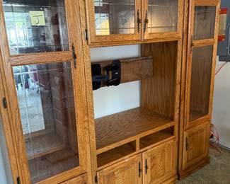 Oak 3 piece Entertainment Center; measurements for the two outside pieces are 75.5” H x 22” W x 17” D; the center piece measurements are 85” H x 39” W x 24” D ; television area is 35” W