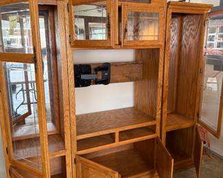 Oak 3 piece Entertainment Center; measurements for the two outside pieces are 75.5” H x 22” W x 17” D; the center piece measurements are 85” H x 39” W x 24” D ; television area is 35” W