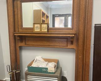 Oak mantel; Dearborn gas heater with ceramic brick inserts