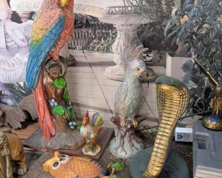 More of the decor and statuary... There are hundreds of concrete, wood, resin and metal pieces. Lord of giant parrots!
