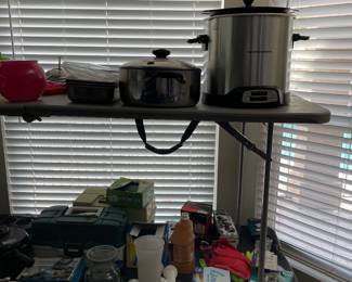 miscellaneous kitchen items, light bulbs, towels, cleaning supplies, fishing gear 