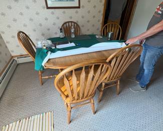 . . . oak table and chairs -- owner still deciding on this item
