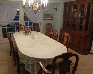 Huge formal dining room table with 10 chairs and three leaves