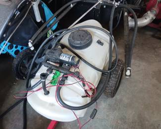 Tow behind tractor fertilizer weed killer