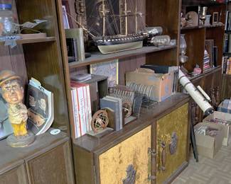 While there is a telescope hiding out on the right, on the left is a figurine of Oliver Hardy, plus a few books on the comedy duo.