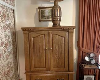 This cabinet and lamp have a match on the other side of the room.