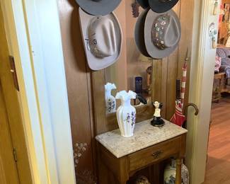 And there are hats. You know, if you buy the hats, you probably should get the entryway mirrored foyer stand. It has places to hang your new hats.