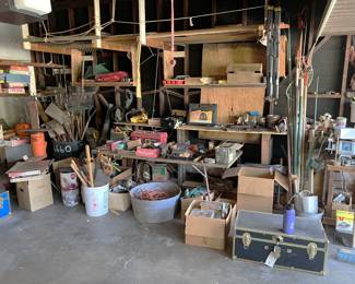 This partial overview features the gardening tools (on the left), various tools on the shelves, and a good number of hand saws.