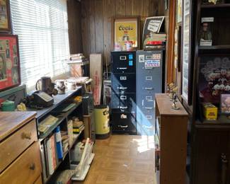More books, two filing cabinets, and a couple of small bookcases are shown here.
