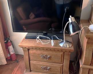 The television is a Samsung, I am not sure the brand of the nightstand. Or the lamp.