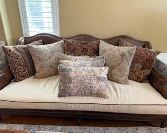 Beautiful leather sofa with creme cushion