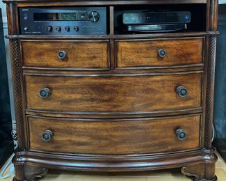 Housing electronics doesn't have to be ugly. Hide it away in this bow front unit.