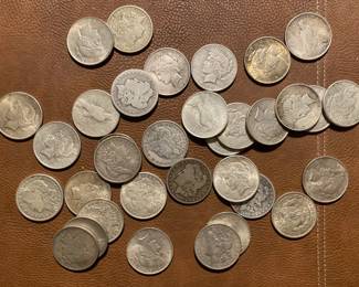 Several Silver dollars (this just represents a few of the Silver Dollars that we will be selling)