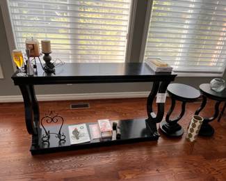 Couch table with matching end tables. 
Multiple decorative items 