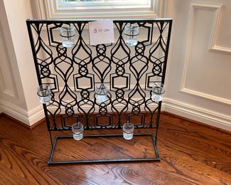 Decorative candle holder for floor or can be mounted. 