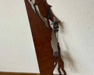 Metal Wall Hanging Of Horse Holding Cowboy Over A Cliff