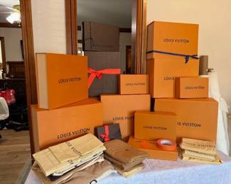 Assortments of Louis Vuitton boxes and bags. 