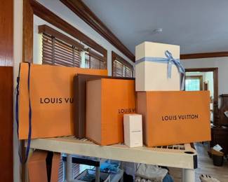Assortments of Louis Vuitton boxes and bags