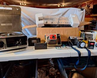 Kodak Slide Projector, Handle Cameras, Sony Digital Mavica camera, 8 Track Player And sony Walkman