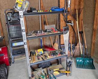 Shelving Full Of HandTools With step stools And Shop Vac