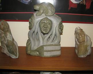 Stone carvings. Center carving by Gene Thomas called "Spirit of the Beaver"