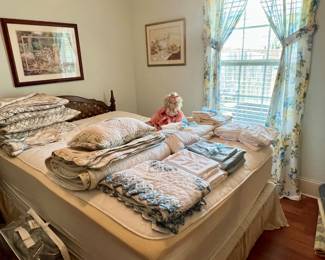 Bed with assortment of linens
