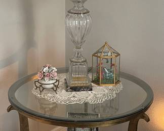 Round heavy brass frame table w/glass top 
Glass lamp w/white shade 
Items on table sold separately  