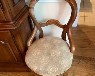 #120 Odd dining Chair on wheels $30.00