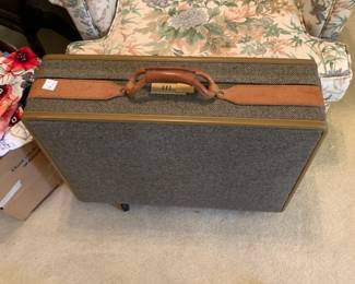 #163 vintage suit case on 3 wheels fabric $40.00