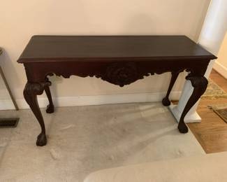 #35 Wood Entry Table w/ball & Claw Feet w/carving - 56x19x31 (has crack across the Back & Scratches) $100.00