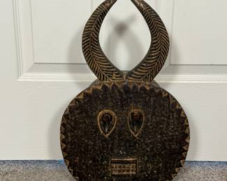 This hand carved Baoule African mask is a nod to Ms. Broyles international travel. A unique piece to add to your collection