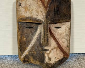 This is a unique artifact known as an African Passport Mask. It is an excellent example of the detail and the artistry of these objects