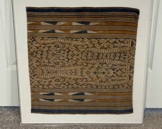 Bidang Women’s Skirt, From the Iban Peoole, Malaysian Borneo
This is a women’s bidang skirt demonstrating an excellent example of the 20th century warp Ikat technique. The piece is attributed to the Iban people. The skirt is mounted on a fabric board and encased in a clear plexiglass shadow box. Item measures 20” Tall x 18” wide. Overall measurement 24 1/2” x 22 1/2”. 