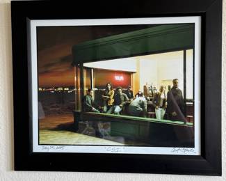 CBS CSI Las Vegas Photo - Signed by the Artist Framed Art Print 'CSI' with Signature and Date.Framed photography art depicting scene with several people inside a cafe replicating the scene of “Nighthawks” by Edward Hopper. The replicated scene is the cast and crew of CSI Las Vegas and is professionally matted and framed with a black molding.The bottom corner features handwritten text: 'CSI' and a date 'July 25, 2005'. The artist's signature is also present in the bottom right corner. Art Field 15 1/2” x 19 1/2”. Overall Measurement 17 3/4” x 19 3/4”. 