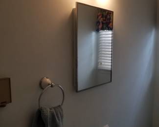 Mirrored medicine cabinet; vanity light