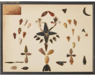 339
A collection of Northwest mounted stone points
Pre-historic or later
Comprising various knapped and carved points of differing stones, shapes and sizes, including arrowheads, barbs, scrapers, and narrow points, all fixed to glass within a frame, with illegible shop label to top
59 pieces approximately
Largest point: 2" H; Smallest: 0.5" H
Estimate: $200 - $400