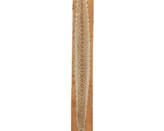 104
A mounted rattlesnake skin
20th/21st century
The skin dried and stretched, mounted to a wood plank with brass tacking
Panel: 93" H x 10" W x 1" D
Estimate: $100 - $200