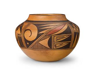 189
Garnet Pavatea (1915-1981, Hopi-Tewa)
A polychrome pottery jar, mid/late 20th century
Signed to underside: Garnet Pavatea / Sichomovi / (Hopi) / [flying ant cipher]
The large three-color olla form jar with a wide band of curvilinear and geometric motifs
7" H x 9.25" W
Estimate: $500 - $700