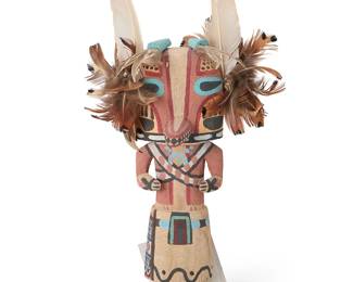 254
Larry Melendez
(b. 1960s, Hopi-Tewa)
A Hopi Pueblo Honan Badger katsina
Polychrome painted cottonwood, feathers, corn husk
With pointed toothed snout, turquoise paint accents, badger claw motifs, and feathers to mask, unsigned
10.5" H x 6" W x 3.5" D
Estimate: $200 - $300