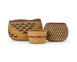 A group of polychrome Northwest baskets
Early/mid-20th century; Northern California & Northwest Coast
Three twined bowls comprising a small Hupa/Yurok/Karuk basketry bowl with four stacked triangle floating motifs (3" H x 4.5" Dia.), a similar style diminutive bowl with diagonal imbricated banding (2.5" H x 3.5" Dia.), and a miniature Northwest Coast style cylindrical basket with ticked banding (1.75" H x 2.5" Dia.)
3 pieces
Estimate: $400 - $600