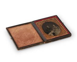215
A Civil War era tintype
A tintype depicting a seated husband and wife, with a chased gold-toned metal preserver within a light orange velvet-lined tooled leather case
Sight: 2.5" H x 2" W
Estimate: $300 - $500