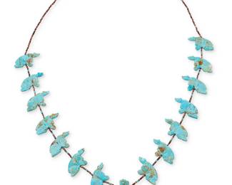 324
A Southwest carved turquoise bear fetish necklace
Late 20th century
Comprising a single strand necklace with carved turquoise bears and a central standing bear, with turquoise and shell heishi and a silver cone clasp
30.5" L x 1.875" H
63.7 grams gross
Estimate: $200 - $400