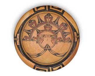 241
A Hopi yellowware pottery bowl
Early 20th century
Unsigned
The three-color bowl with Polik Mana or Butterfly Maiden katsina motif to the interior and bands of geometric and stepped motifs to shoulder
2.5" H x 10.25" Dia.
Estimate: $800 - $1,200