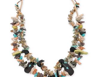 326
Two Southwest Zuni-style carved stone fetish necklaces
Late 20th century
Featuring two single strand necklaces of stacked carved stone animal fetish figures, including heartline bears, wolves, foxes, and squirrels, in turquoise and various multicolored stones, including one with graduated stacked animals and a central carved turquoise standing bear, with fine shell heishi (33.5" L), and one with a large central carved jet standing bear and a traditional wrapped neck cord (32" L)
2 pieces
238.5 grams gross
Estimate: $300 - $500